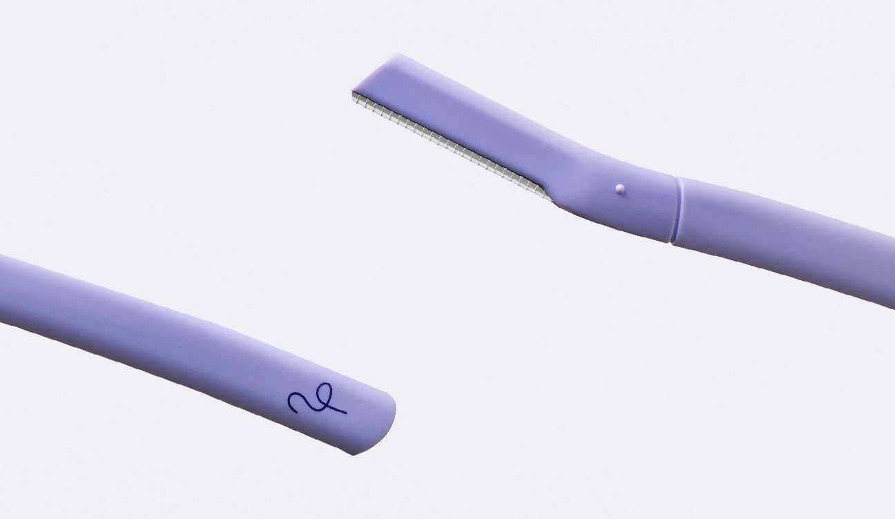 Two lilac purple Flamingo Disposable Dermaplanes on a white background
