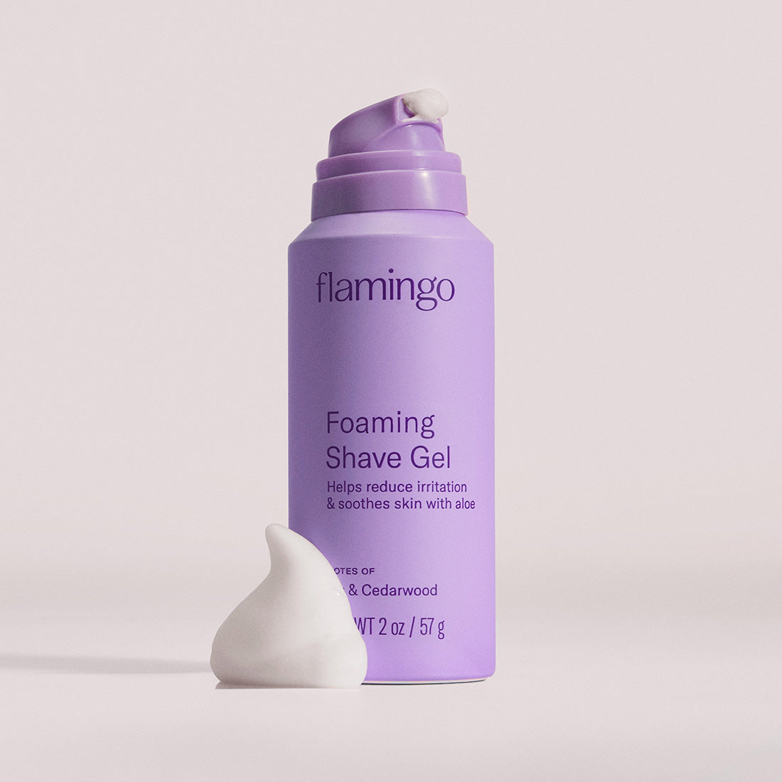 Can of mini Foaming Shave Gel on a grey background.
