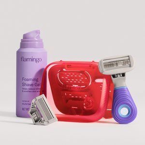 Mini razor and case next to mini shave gel on a white background.