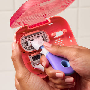 Person loading a new blade from the case onto the mini razor.