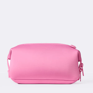Pink Dagne Dover toiletry bag on a white background.