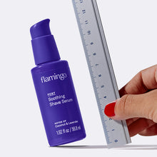Hand holding a ruler next to the serum.