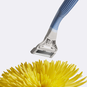 Pubic Razor floating over a yellow flower.