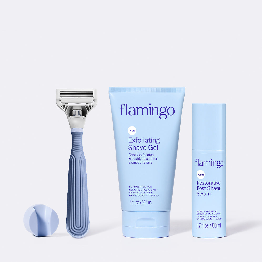 Blue Shower Holder, Pubic Razor, Pubic Exfoliating Shave Gel and the Restorative Post Shave Serum on a white background.