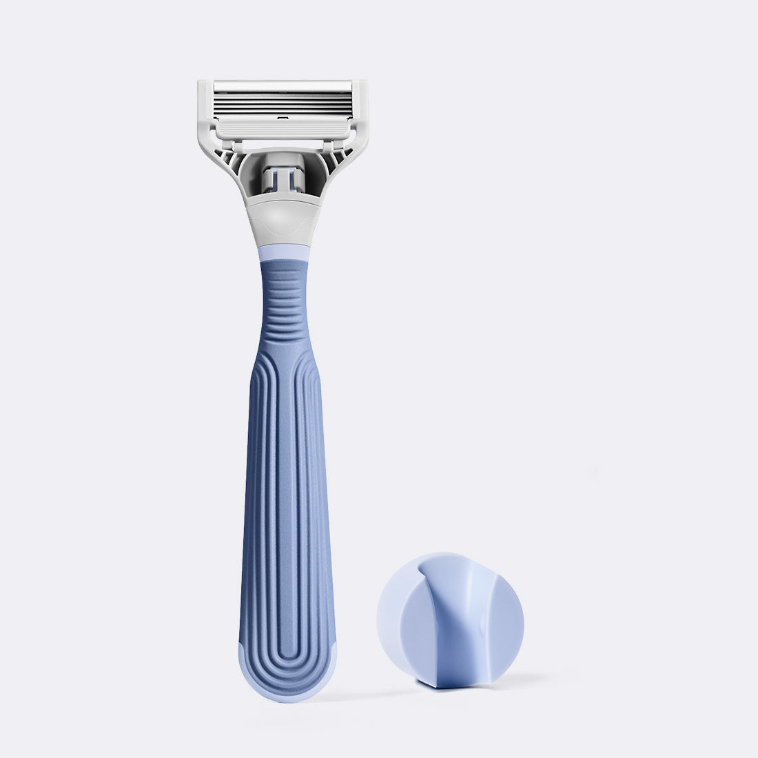 Pubic razor and shower holder on a white background.