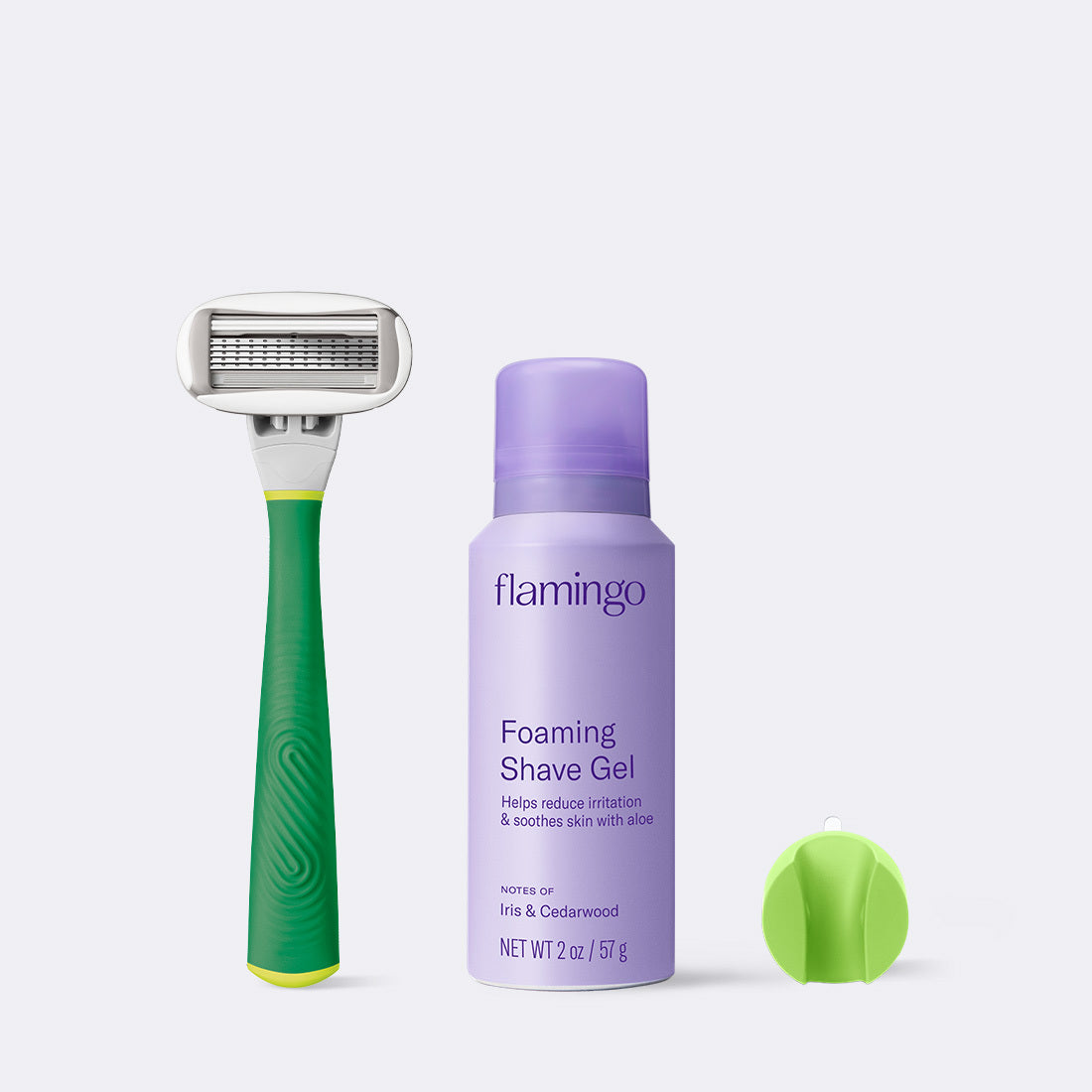 Bright Green Original Razor, Mini shave gel and shower holder on a grey background.