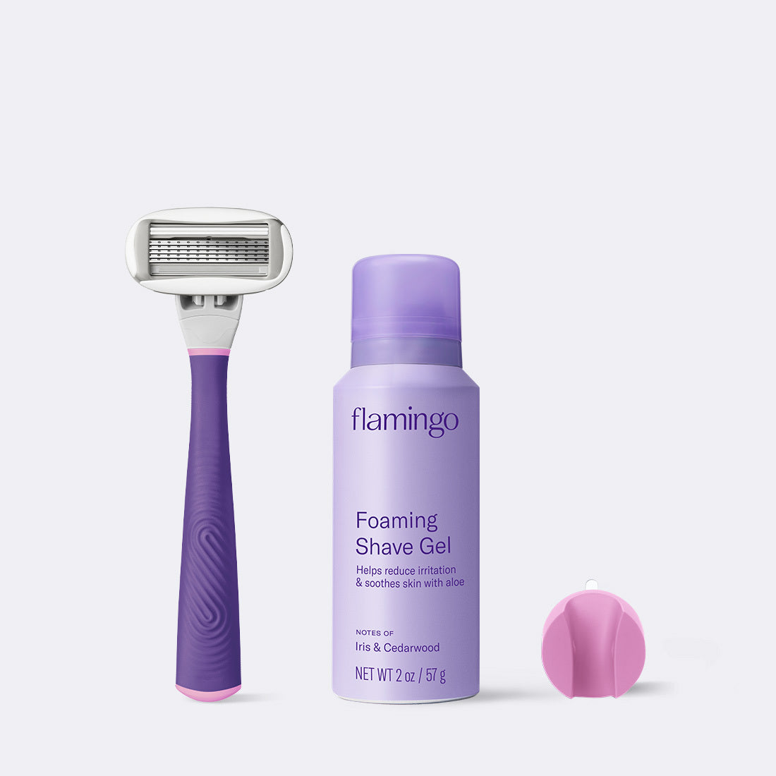 Bright Purple Original Razor, Mini shave gel and shower holder on a grey background.