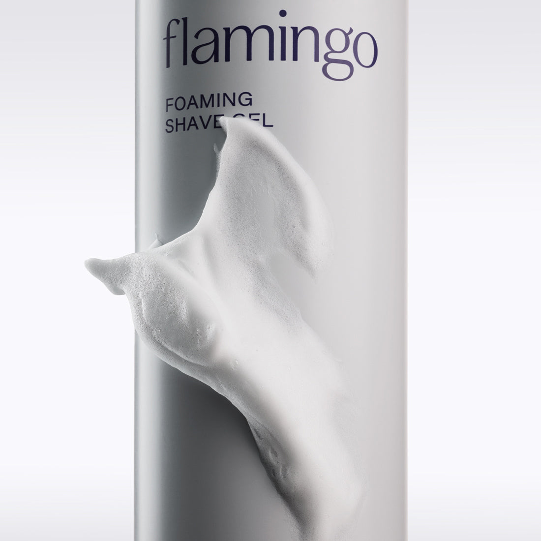 Close up of the Flamingo Foaming Shave Gel can with a swoosh of shave gel on it