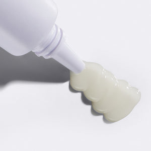 Close up of Flamingo Ingrown Spot Treatment being squeezed from the tube, highlighting the light, gel texture