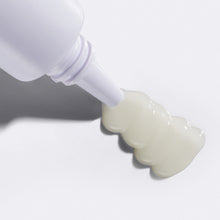 Close up of Flamingo Ingrown Spot Treatment being squeezed from the tube, highlighting the light, gel texture