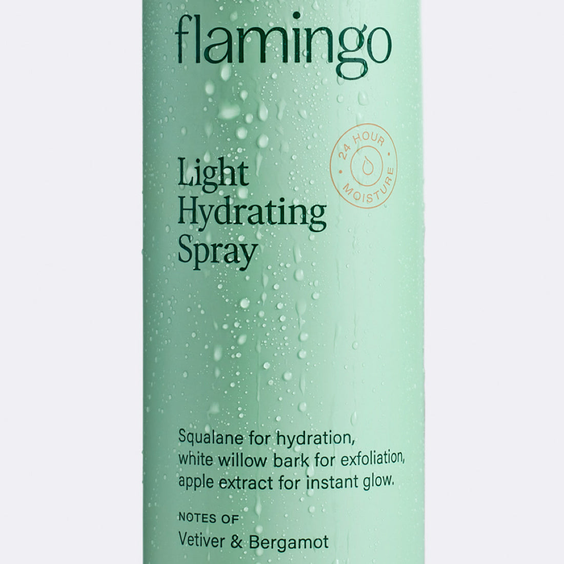 Close up of the Flamingo Light Hydrating Spray can with water condensed on the outside so it appears as if it had been in the shower