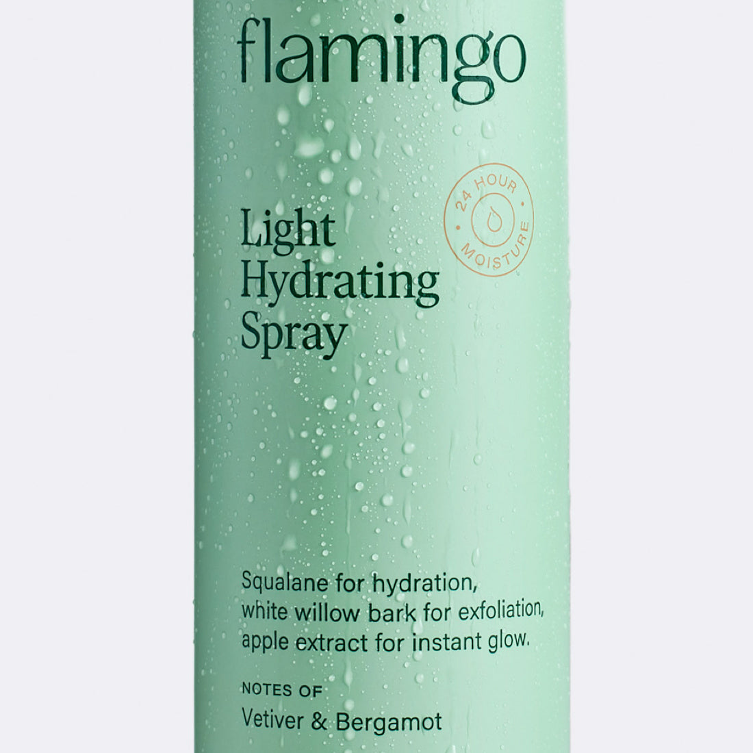 Close up of Flamingo Light Hydrating Spray can with water condensed on it as if it had been in the shower
