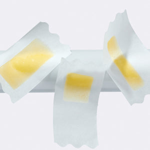 Three different sized Flamingo wax strips on a white background