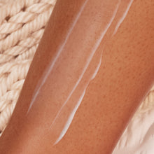 Close up of the Soothing Post Shave Serum applied to a persons shin.